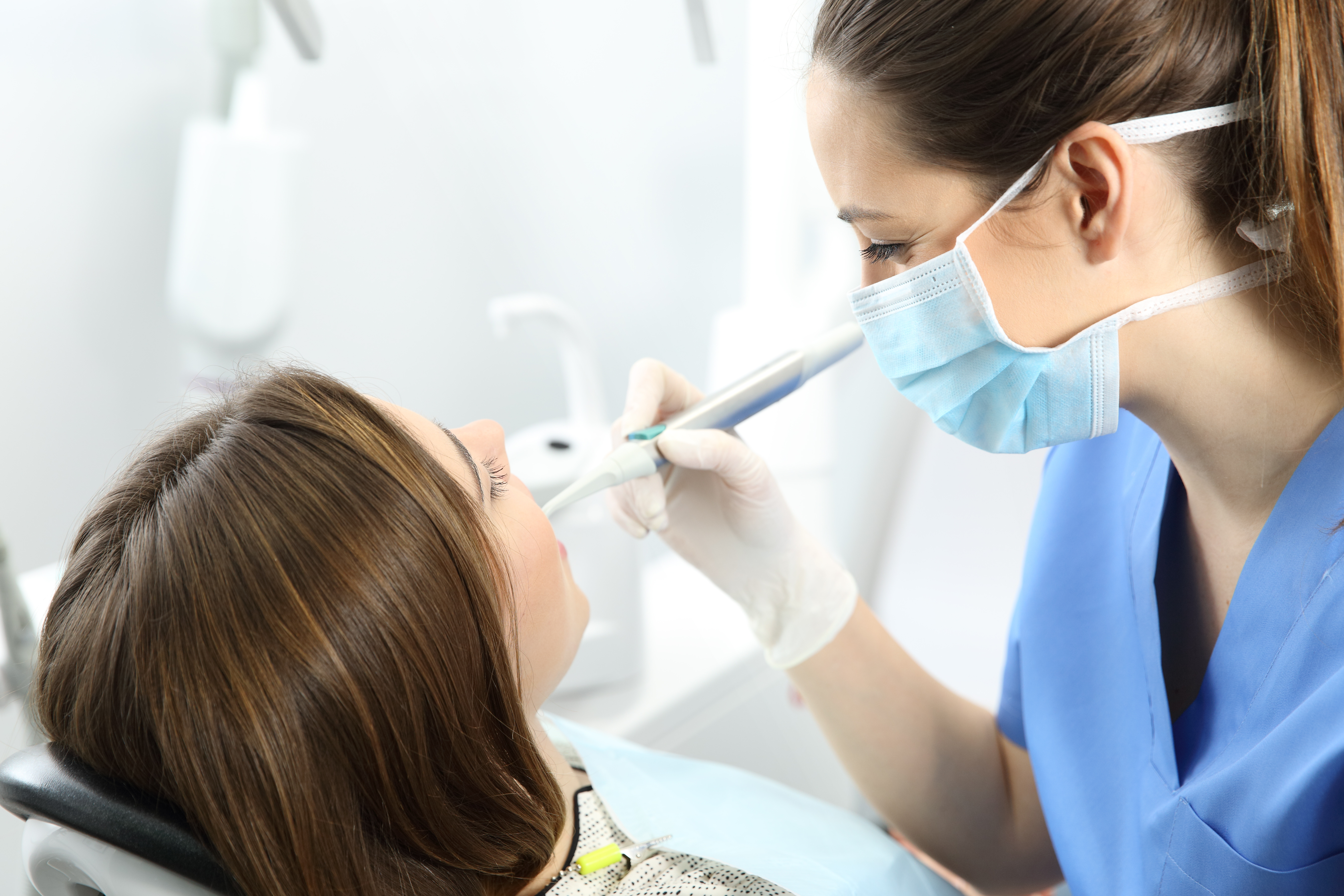 Dentist using modern technology during patient care