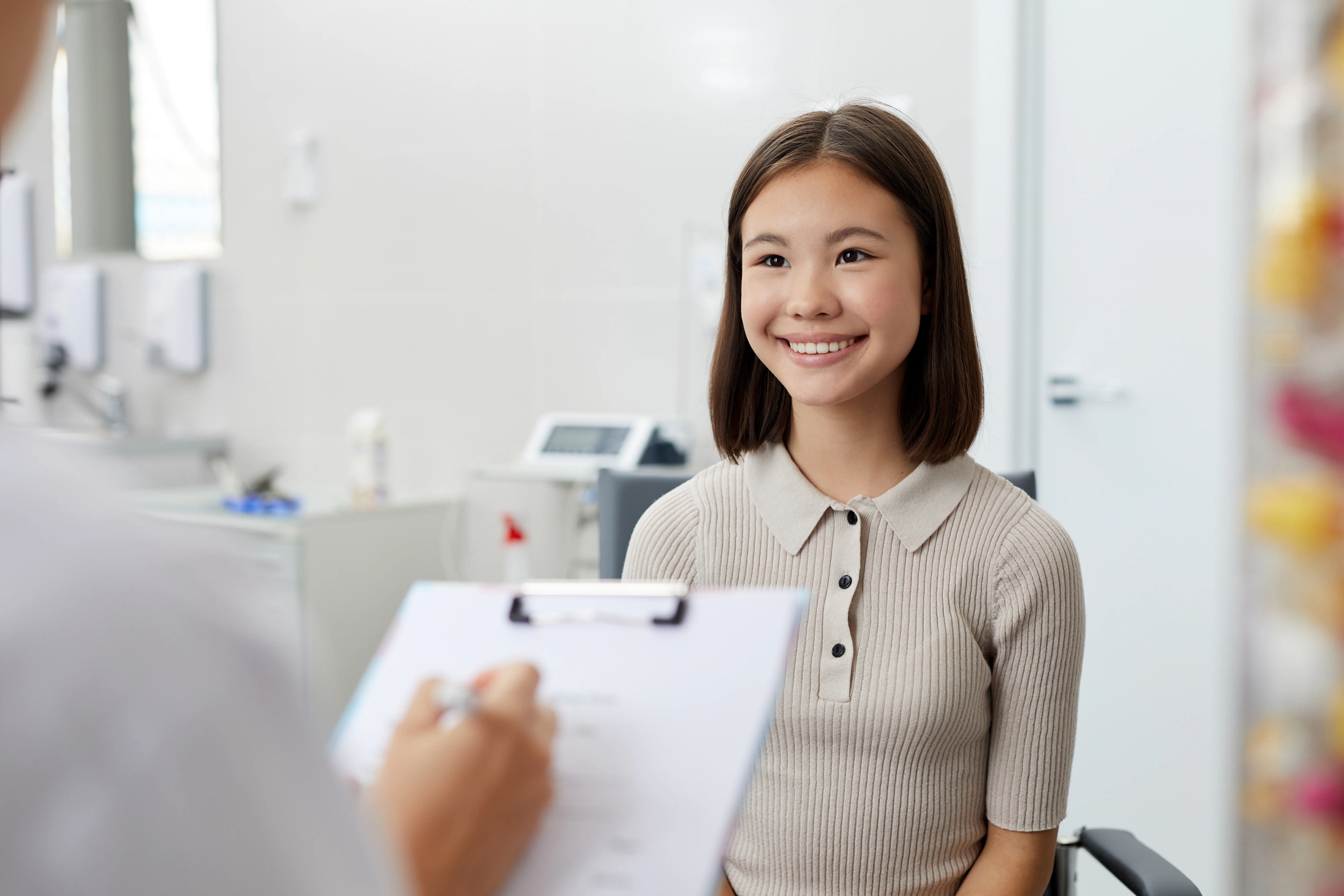 A smiling patient during a calm dental consultation