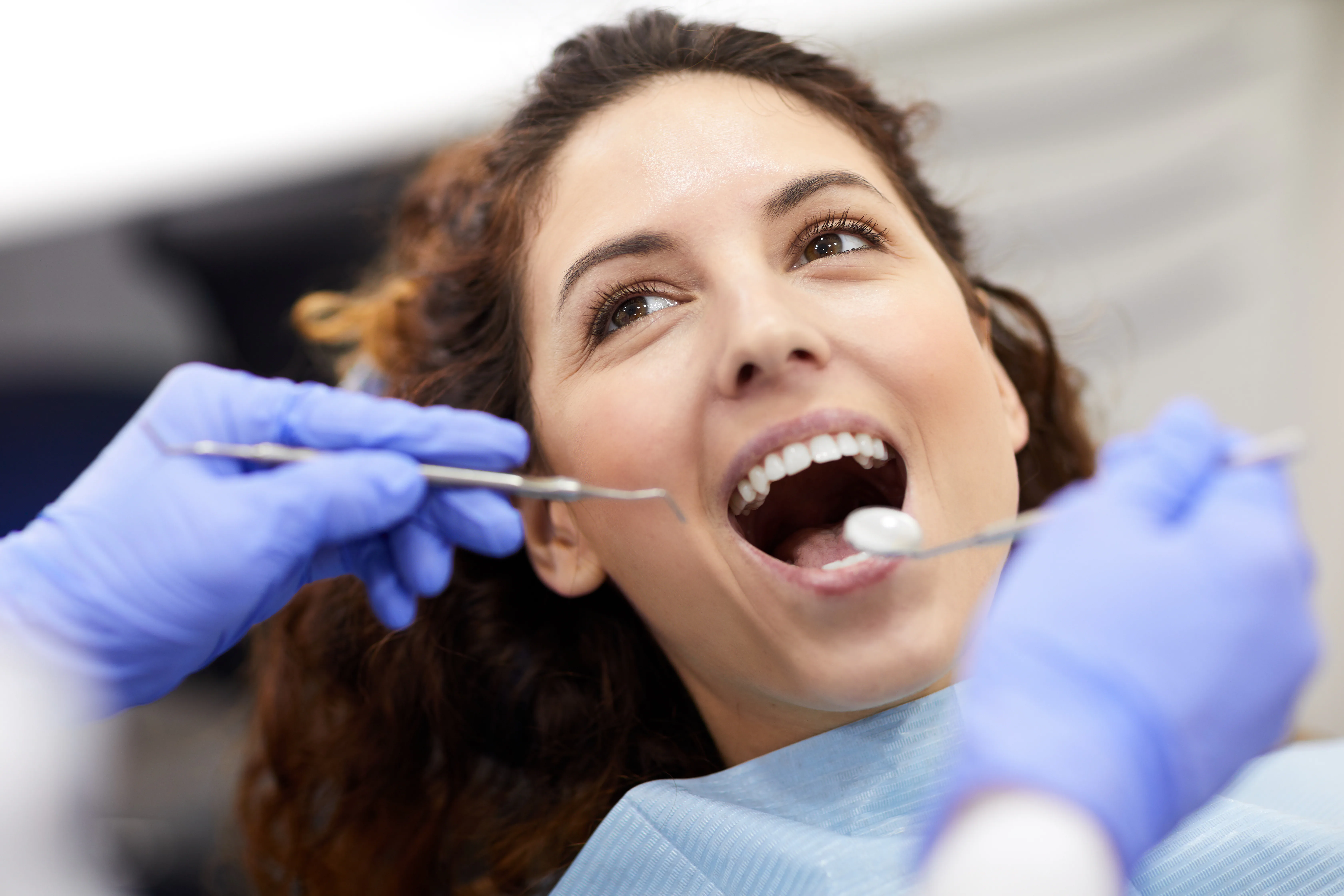 Dentist reviewing information with a patient at a first visit